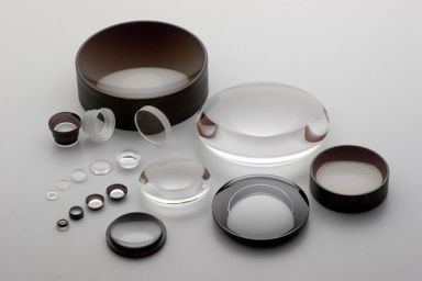 Optical lens elements and mounting parts